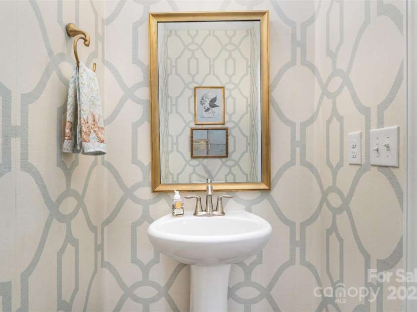 11234 Smokethorn Drive, Concord, NC 28027.  MLS# CAR4243179, YatesRealty ID 18031. Downstairs powder room