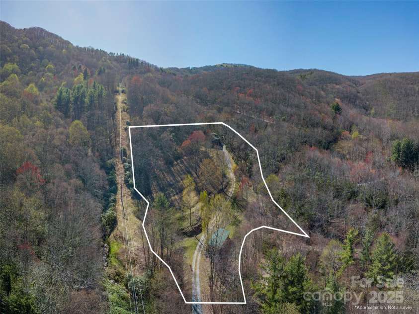 90 Junco Trail, Waynesville, NC 28785.  MLS# CAR4252158, YatesRealty ID 18032. Ariel View of the 3.45 acres fully private and enveloped by nature with thousands of acres of land surrounding you including the SWAG Properties, Cataloochee Ski Resort and just beyond that, the Great Smokey Mountain Nati