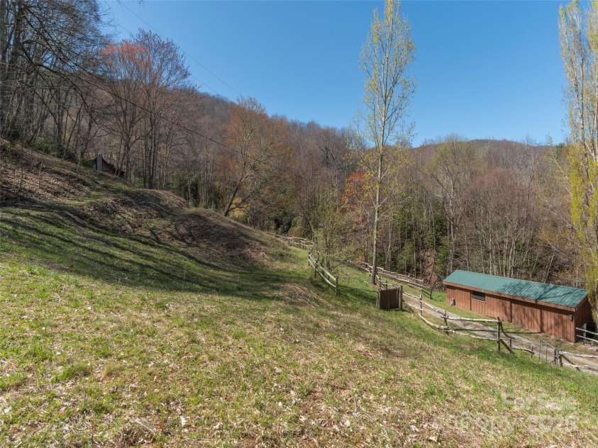 90 Junco Trail, Waynesville, NC 28785.  MLS# CAR4252158, YatesRealty ID 18032. Expansive Retreat encompassing 3.45 acre property.  View from upper part of property line.