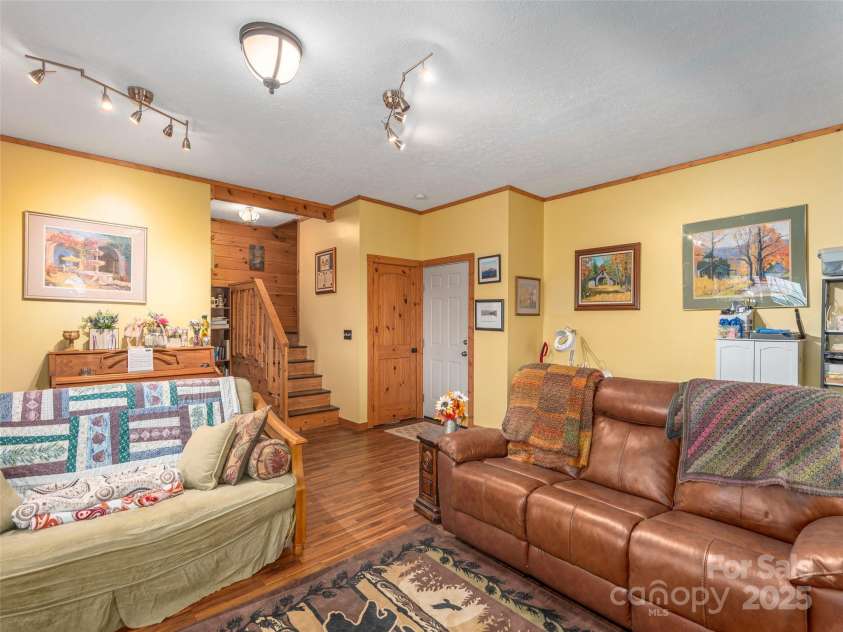 90 Junco Trail, Waynesville, NC 28785.  MLS# CAR4252158, YatesRealty ID 18032. Fully Finished Basement/Hobby/Bonus Room with tall under stair storage room