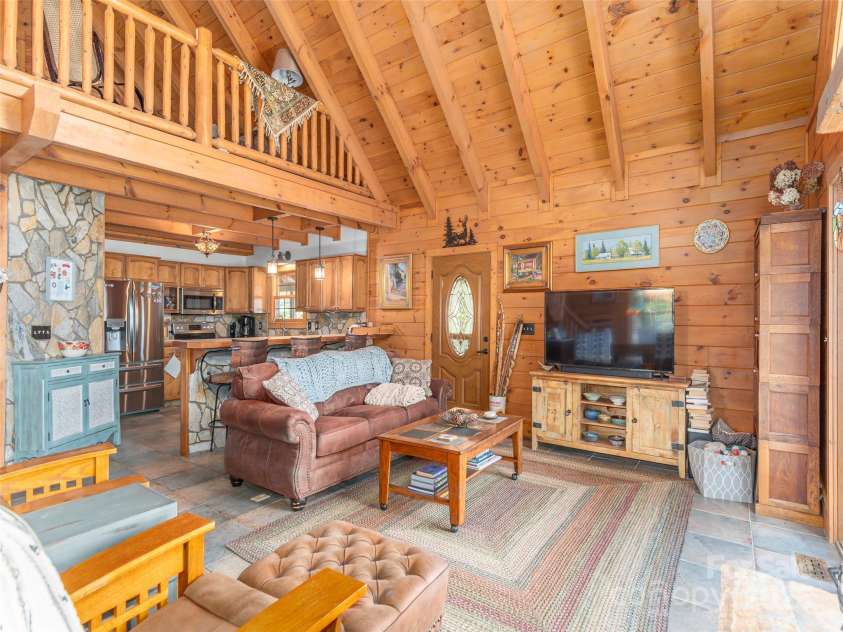 90 Junco Trail, Waynesville, NC 28785.  MLS# CAR4252158, YatesRealty ID 18032. Great Room, Living and Kitchen areas