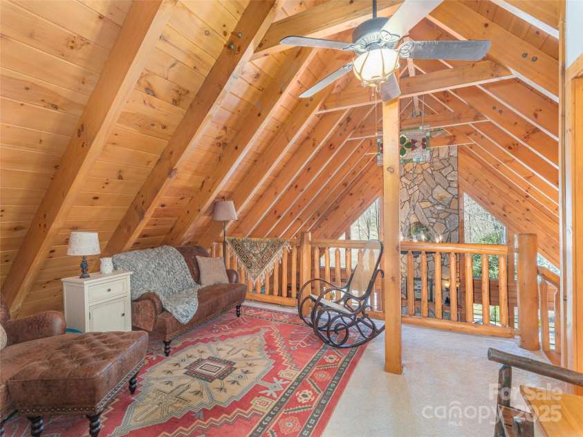 90 Junco Trail, Waynesville, NC 28785.  MLS# CAR4252158, YatesRealty ID 18032. Loft Area View facing Great Room with Floor to Ceiling 2 Story Modern Windows