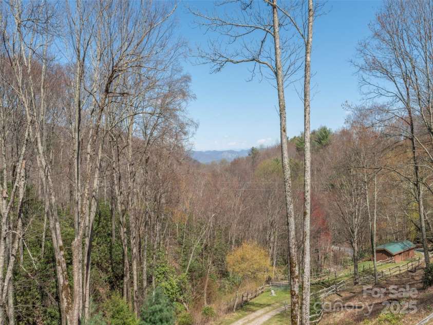 90 Junco Trail, Waynesville, NC 28785.  MLS# CAR4252158, YatesRealty ID 18032. Long Range Year Round Mountain View from Deck
