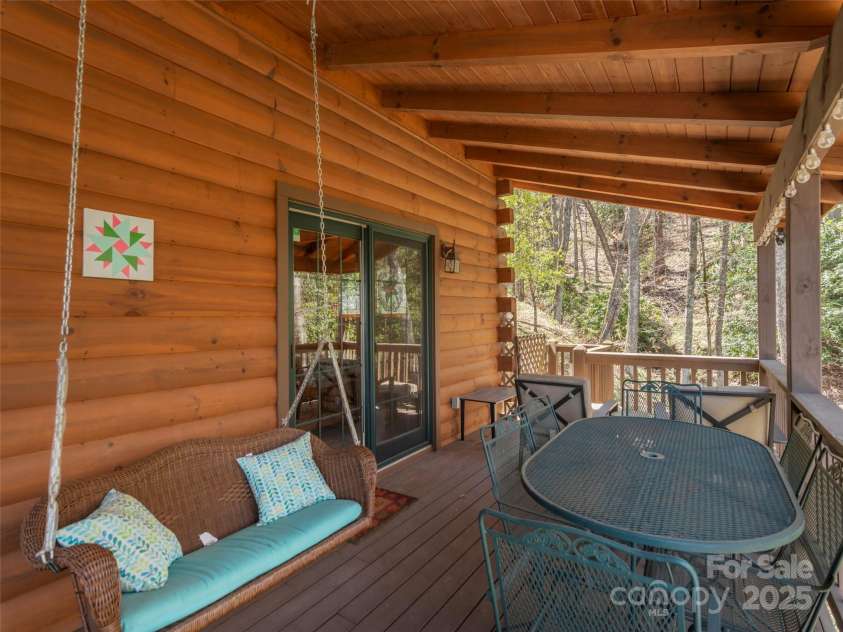 90 Junco Trail, Waynesville, NC 28785.  MLS# CAR4252158, YatesRealty ID 18032. Upper Level Porch Relaxing Area facing the rushing stream