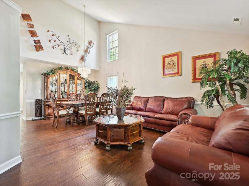 7923 Shiny Meadow Lane, Charlotte, NC 28215.  MLS# CAR4252293, YatesRealty ID 18034. Volume ceilings grace the formal living areas.