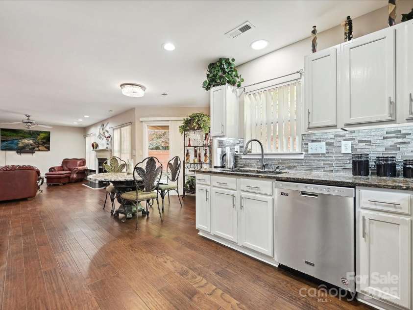 7923 Shiny Meadow Lane, Charlotte, NC 28215.  MLS# CAR4252293, YatesRealty ID 18034. Wood flooring throughout creates a seamless transition