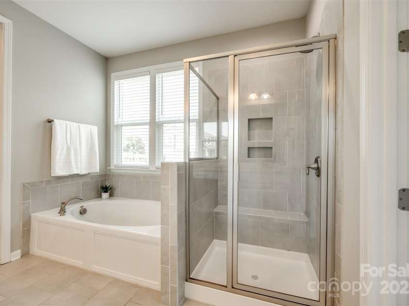 173 Morgans Branch Road, Belmont, NC 28012.  MLS# CAR4266195, YatesRealty ID 18036. Garden tub/shower in primary bathroom