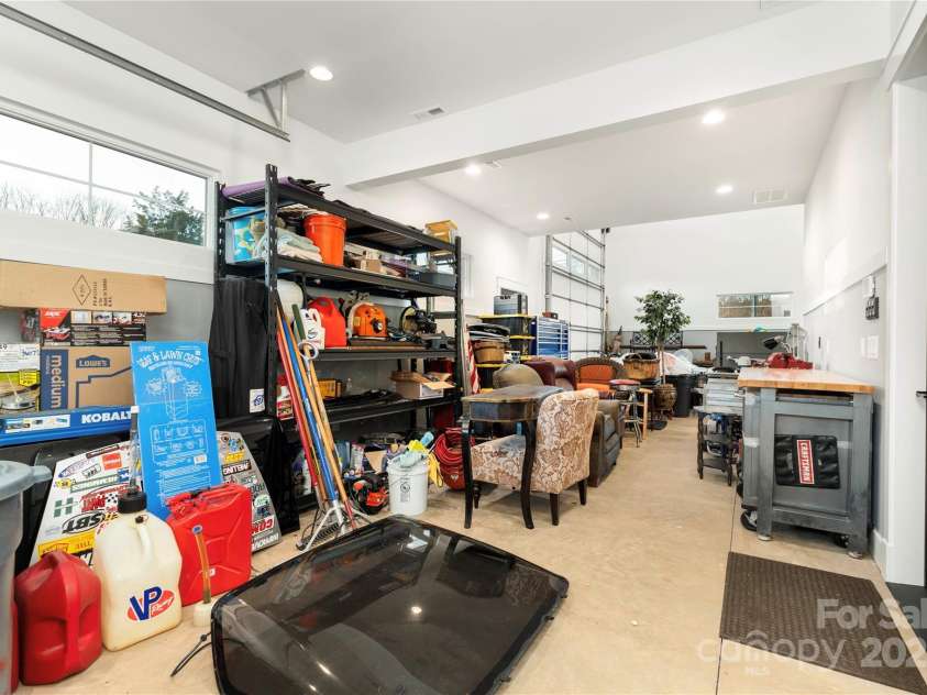 106 Isle Of Pines Road, Mooresville, NC 28117.  MLS# CAR4307196, YatesRealty ID 1804. Ample storage and workspace throughout conditioned garage space - interior of lot 1 home