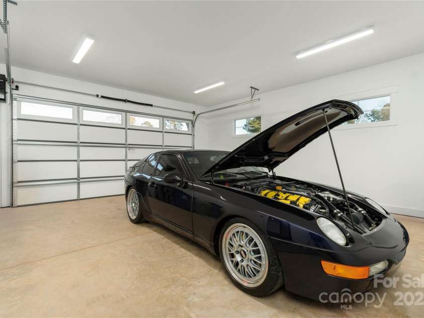 106 Isle Of Pines Road, Mooresville, NC 28117.  MLS# CAR4307196, YatesRealty ID 1804. Separate two-car, front load garage