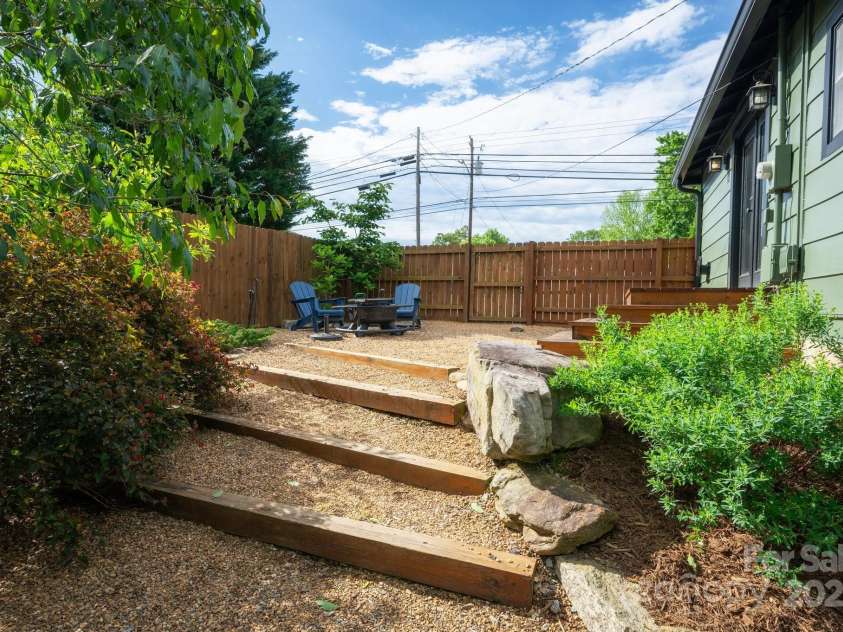 72 Rock Hill Road, Asheville, NC 28803.  MLS# CAR4250298, YatesRealty ID 18042. Steps lead to grassy back yard