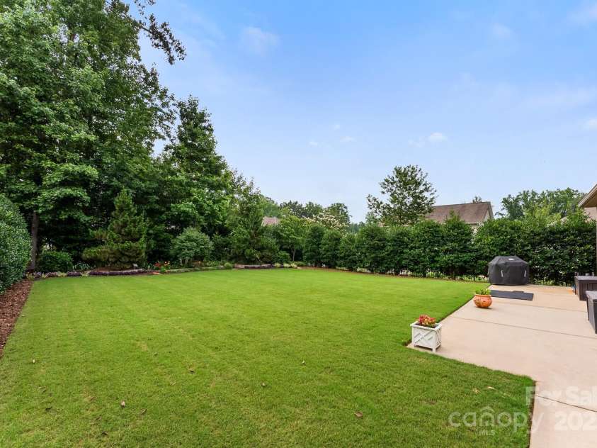 708 Ardent Trail, Belmont, NC 28012.  MLS# CAR4267036, YatesRealty ID 18047. Immaculate landscaping with privacy trees