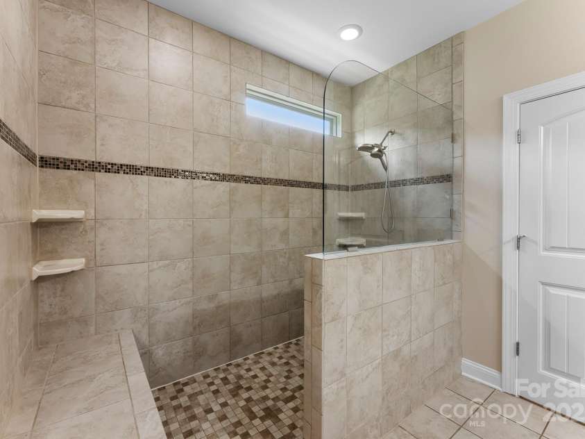 708 Ardent Trail, Belmont, NC 28012.  MLS# CAR4267036, YatesRealty ID 18047. Large walk-in tiled shower