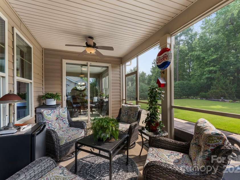 708 Ardent Trail, Belmont, NC 28012.  MLS# CAR4267036, YatesRealty ID 18047. Screened-in 10' x 17' back porch