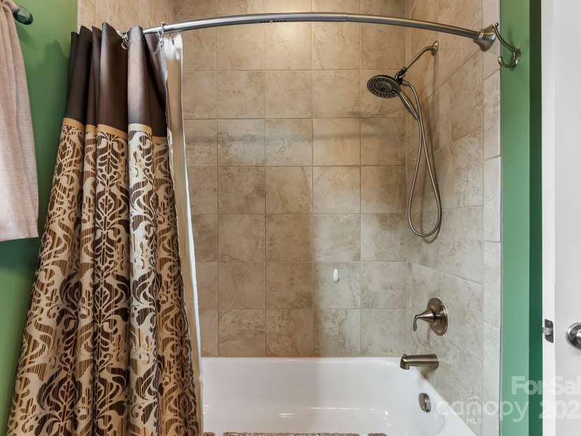 708 Ardent Trail, Belmont, NC 28012.  MLS# CAR4267036, YatesRealty ID 18047. Tiled tub/shower