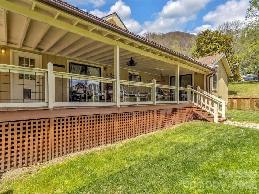 96 Garden Court, Maggie Valley, NC 28751.  MLS# CAR4371923, YatesRealty ID 18049. Stream behind house