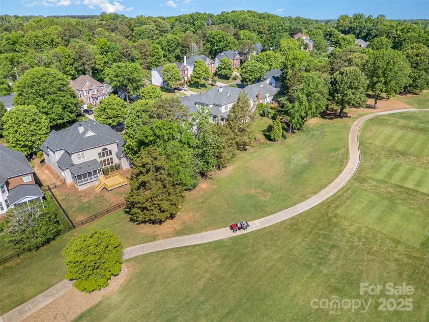 12004 Willingdon Road, Huntersville, NC 28078.  MLS# CAR4248994, YatesRealty ID 18050. View of back of home at Hole 5