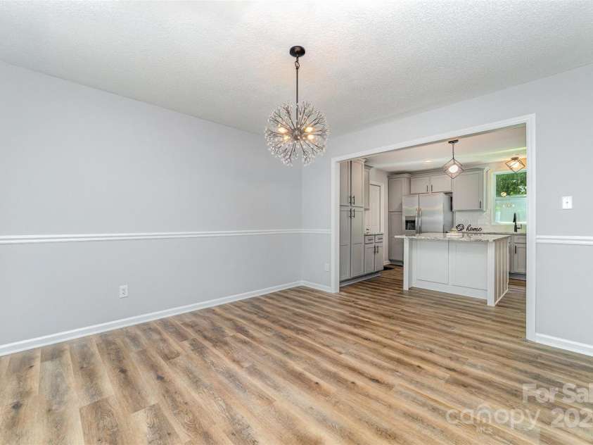 1640 English Knoll Drive, Matthews, NC 28105.  MLS# CAR4249167, YatesRealty ID 18051. Dining Room view from entry way