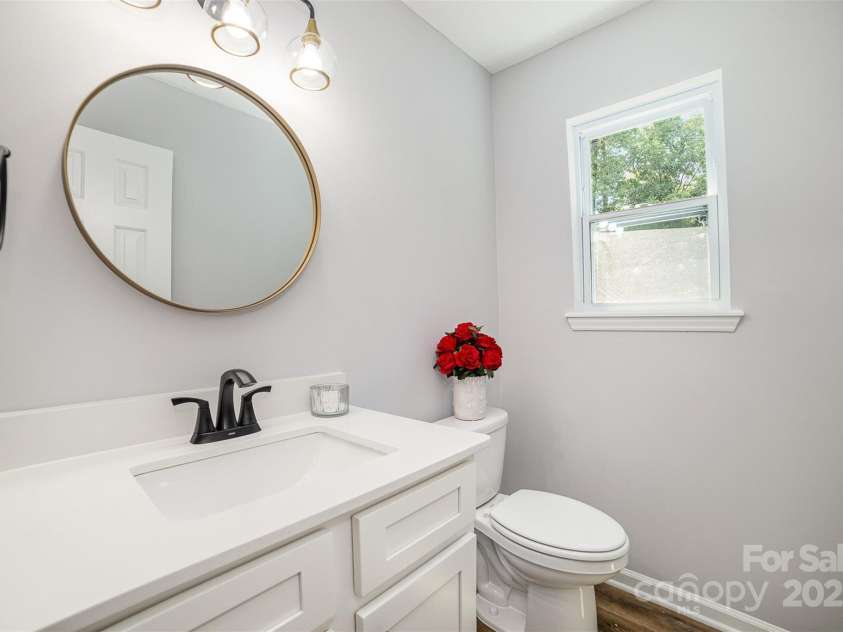 1640 English Knoll Drive, Matthews, NC 28105.  MLS# CAR4249167, YatesRealty ID 18051. Downstairs Half Bath