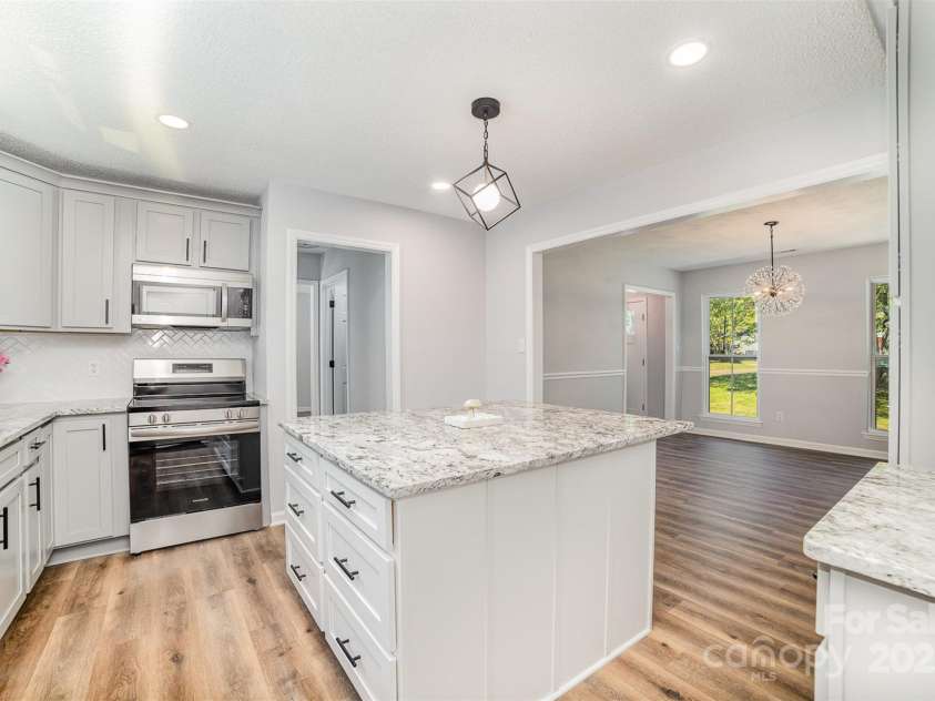 1640 English Knoll Drive, Matthews, NC 28105.  MLS# CAR4249167, YatesRealty ID 18051. Kitchen/dining room view from garage entry