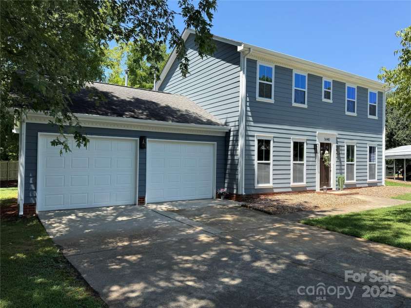 1640 English Knoll Drive, Matthews, NC 28105.  MLS# CAR4249167, YatesRealty ID 18051. View of 2 car garage with dual overhead doors.