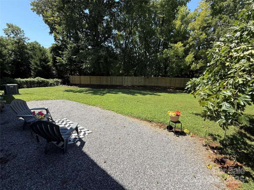 1640 English Knoll Drive, Matthews, NC 28105.  MLS# CAR4249167, YatesRealty ID 18051. View of backyard from family room/patio door