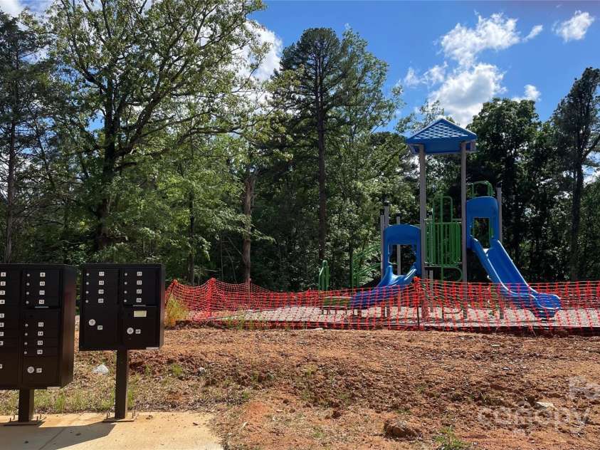 4033 Grommet Court, Matthews, NC 28105.  MLS# CAR4254660, YatesRealty ID 18061. Mail Kiosk and playground in culdesac