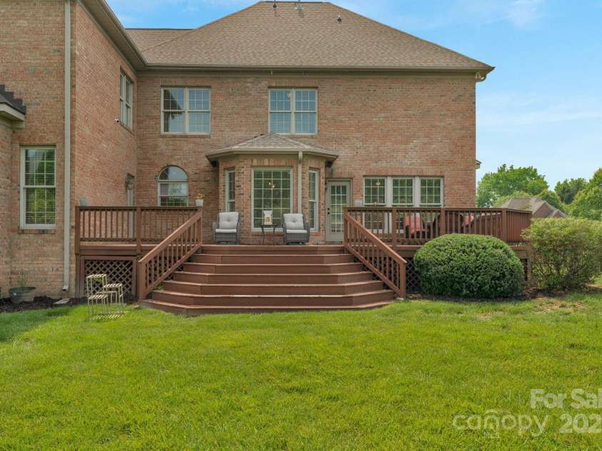 9008 Skipaway Drive, Waxhaw, NC 28173.  MLS# CAR4244086, YatesRealty ID 18063. Backyard with Desk