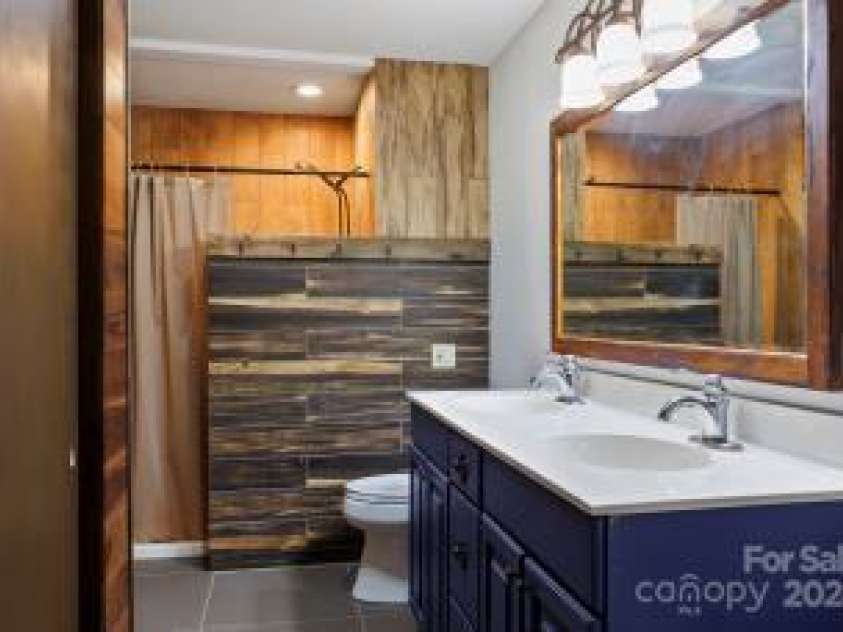 395 Old Fiddle Road, Waynesville, NC 28786.  MLS# CAR4184679, YatesRealty ID 1807. Primary bath