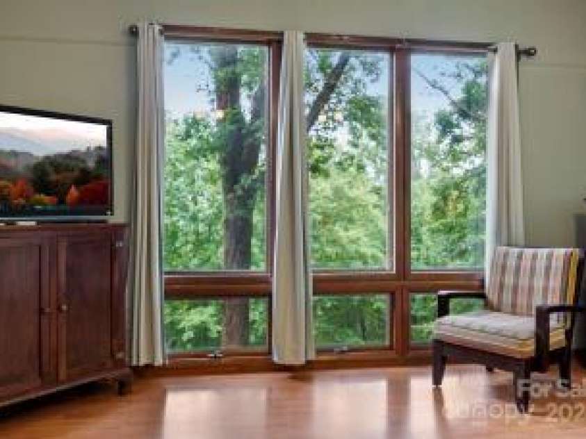 395 Old Fiddle Road, Waynesville, NC 28786.  MLS# CAR4184679, YatesRealty ID 1807. Primary bedroom windows