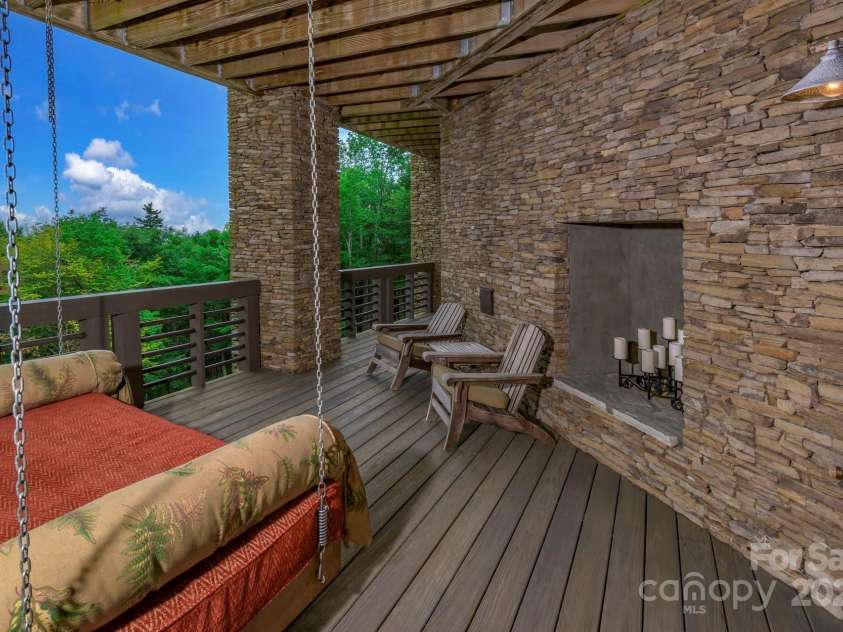 610 Rocky Parkway, Banner Elk, NC 28604.  MLS# CAR4266587, YatesRealty ID 18070. Covered Deck off Bedroom Basement