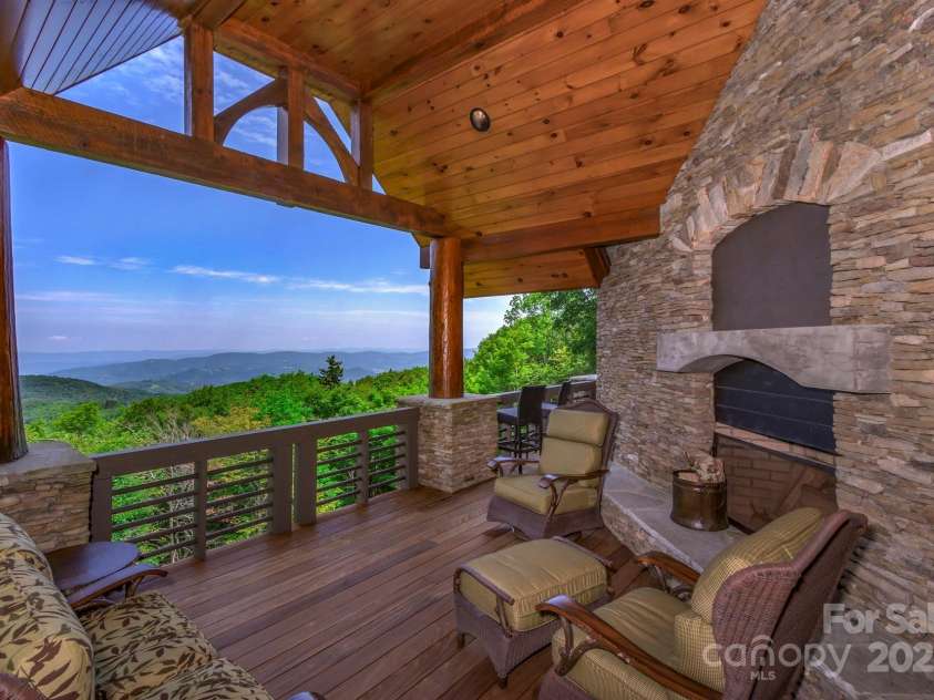 610 Rocky Parkway, Banner Elk, NC 28604.  MLS# CAR4266587, YatesRealty ID 18070. Grand Covered Deck with a fireplace on main