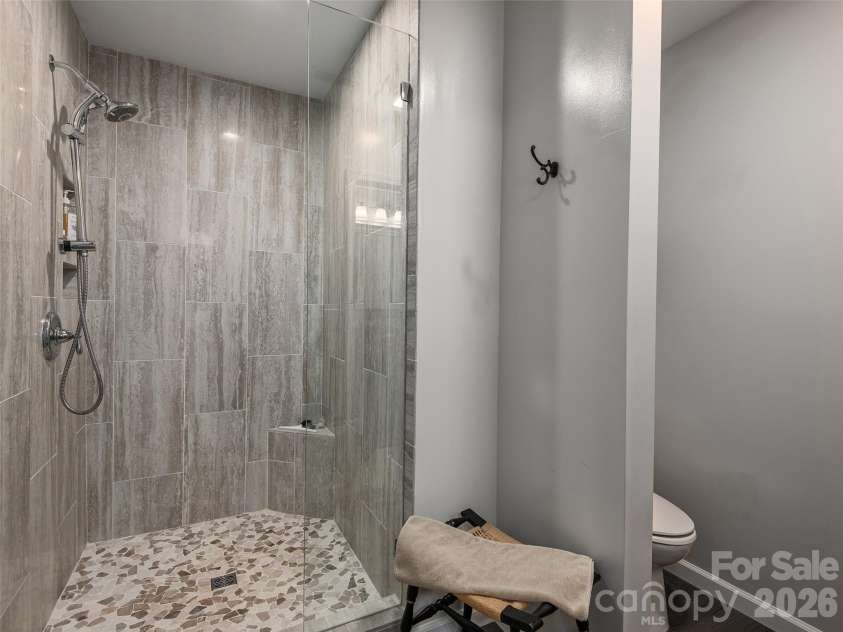 126 Stonebridge Drive, Hendersonville, NC 28739.  MLS# CAR4374699, YatesRealty ID 18072. Downstairs Walk In Shower