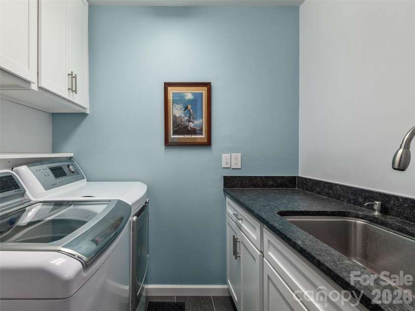 126 Stonebridge Drive, Hendersonville, NC 28739.  MLS# CAR4374699, YatesRealty ID 18072. Upstairs Laundry Room