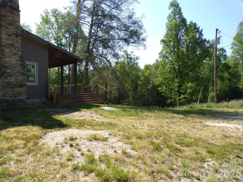 202 Honor Lane, Hendersonville, NC 28792.  MLS# CAR4345433, YatesRealty ID 18074. Side yard