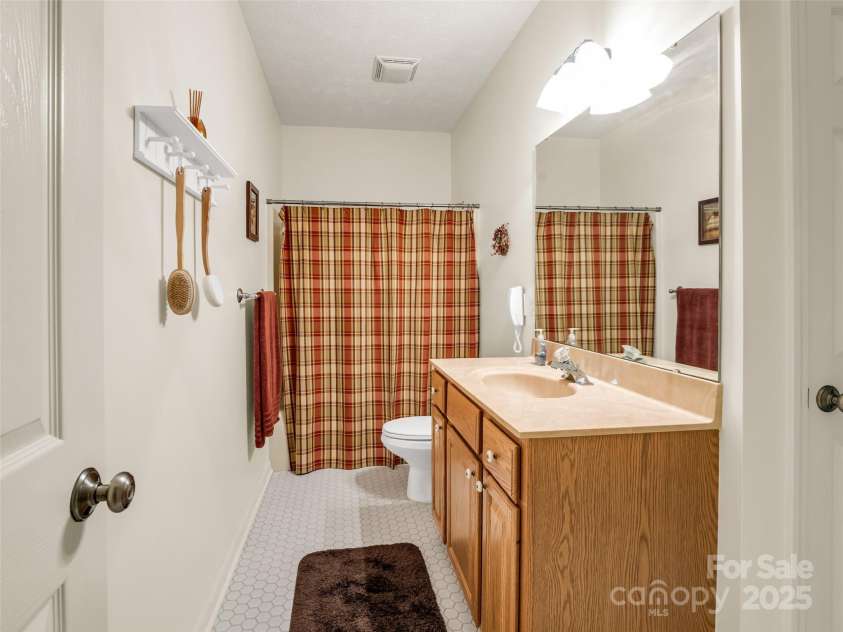 11 Wedge Court, Hendersonville, NC 28739.  MLS# CAR4260142, YatesRealty ID 18075. Lower level 3rd Full Bath