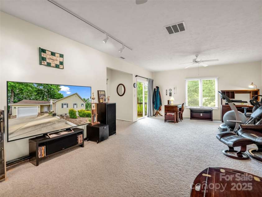 11 Wedge Court, Hendersonville, NC 28739.  MLS# CAR4260142, YatesRealty ID 18075. Lower Level family room