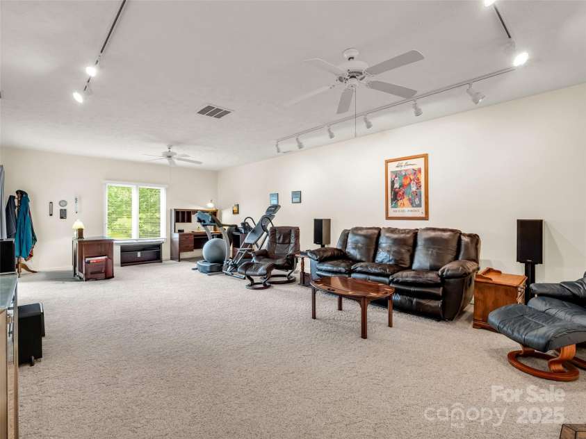 11 Wedge Court, Hendersonville, NC 28739.  MLS# CAR4260142, YatesRealty ID 18075. Lower Level family room