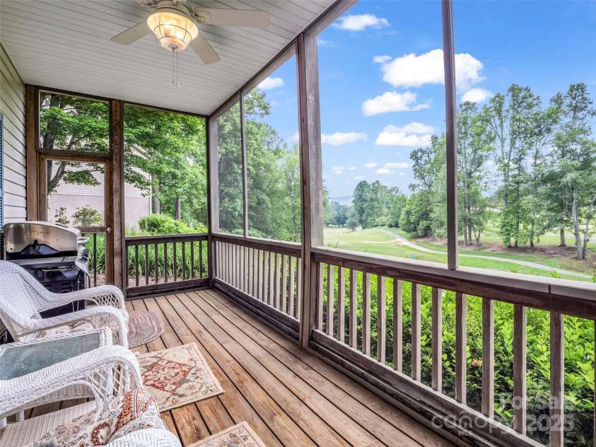 11 Wedge Court, Hendersonville, NC 28739.  MLS# CAR4260142, YatesRealty ID 18075. Lower level screened Porch with golf course view