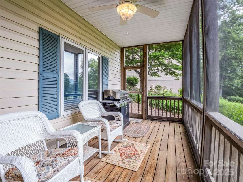 11 Wedge Court, Hendersonville, NC 28739.  MLS# CAR4260142, YatesRealty ID 18075. Lower level Spacious screened porch