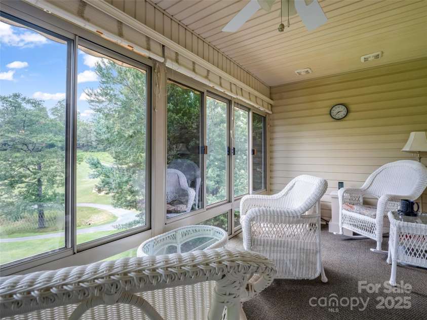 11 Wedge Court, Hendersonville, NC 28739.  MLS# CAR4260142, YatesRealty ID 18075. Sunroom with golf course view