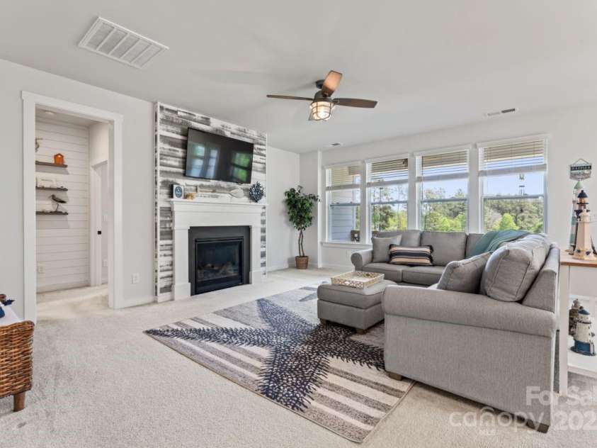 1274 Fishing Creek Road, Clover, SC 29710.  MLS# CAR4240716, YatesRealty ID 18076. Family room w/ gas fireplace & ALL the natural light