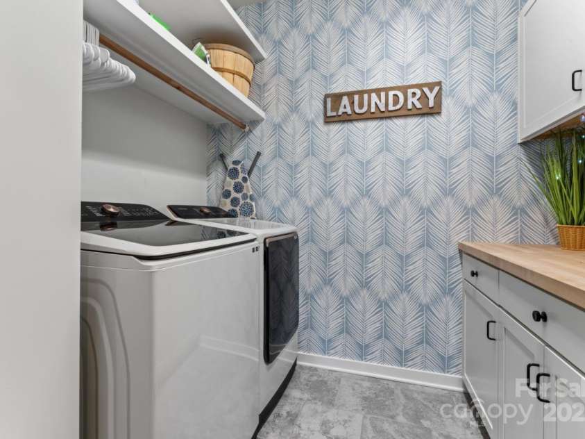 1274 Fishing Creek Road, Clover, SC 29710.  MLS# CAR4240716, YatesRealty ID 18076. Laundry room with custom cabinetry & storage