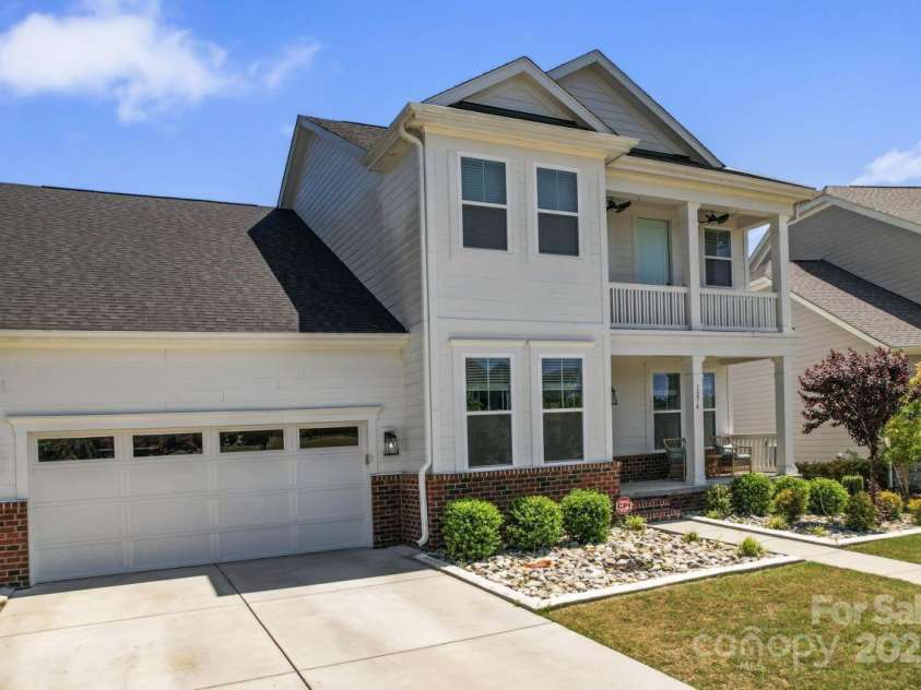 1274 Fishing Creek Road, Clover, SC 29710.  MLS# CAR4240716, YatesRealty ID 18076. Look at that quite close garage door & gorgeous landscaping!