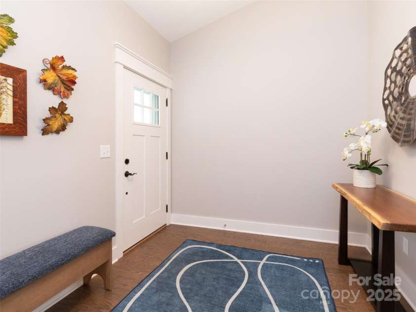 32 Cozy Cottage Way, Arden, NC 28704.  MLS# CAR4308259, YatesRealty ID 18080. Great guests and take jackets in the beautiful foyer with coat closet.