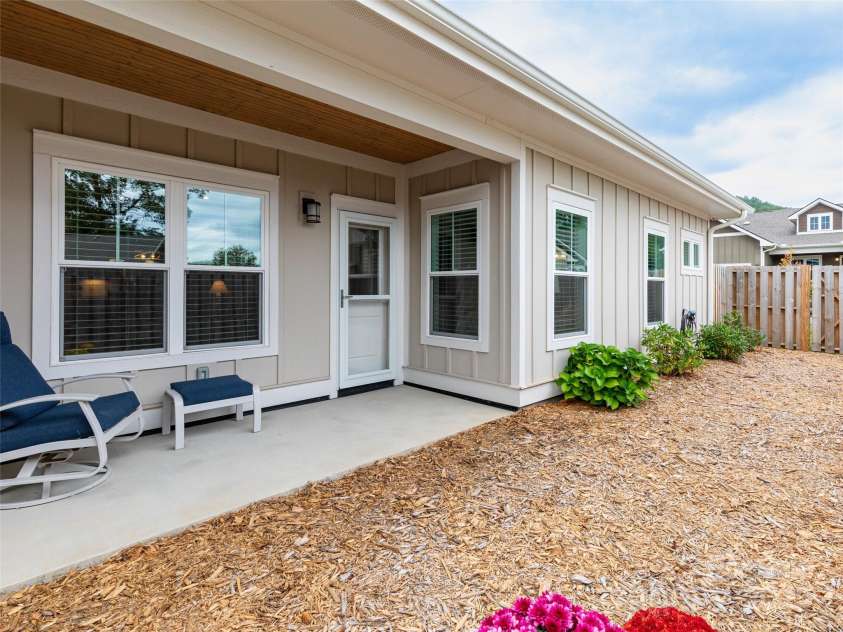 32 Cozy Cottage Way, Arden, NC 28704.  MLS# CAR4308259, YatesRealty ID 18080. Mulched in yard space for easy upkeep.