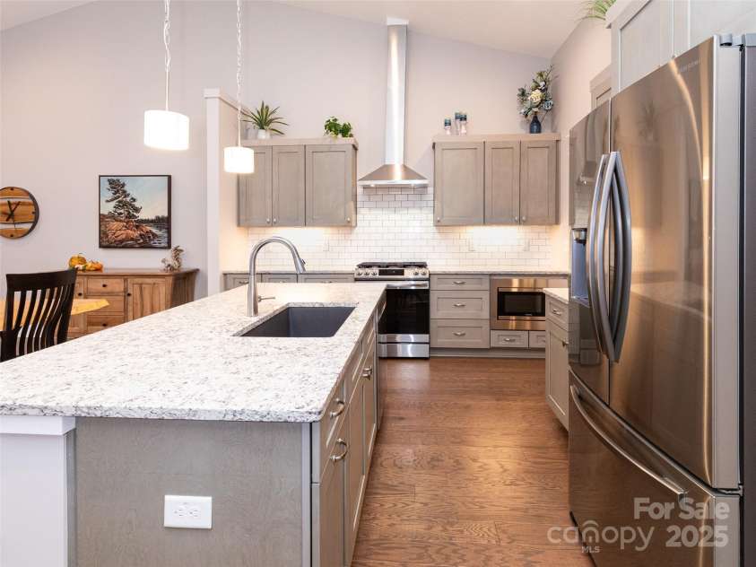 32 Cozy Cottage Way, Arden, NC 28704.  MLS# CAR4308259, YatesRealty ID 18080. Plenty of room and storage in this amazing kitchen.