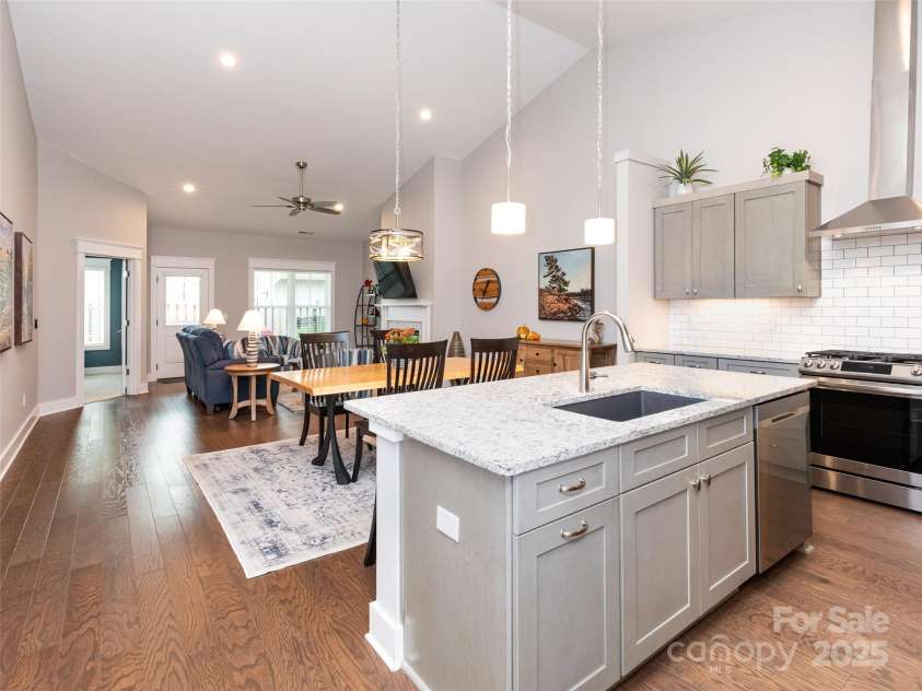 32 Cozy Cottage Way, Arden, NC 28704.  MLS# CAR4308259, YatesRealty ID 18080. Step into the gorgeous open floorplan kitchen, dining area, and living room.
