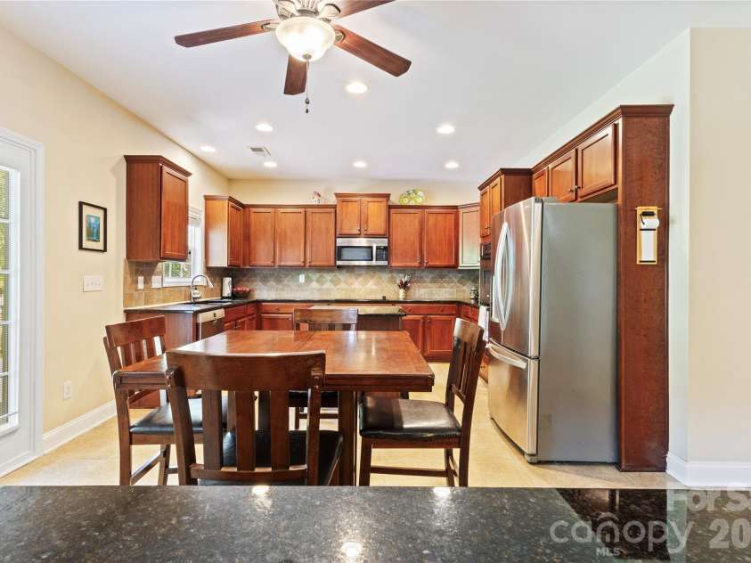 8458 Mossy Cup Trail, Harrisburg, NC 28075.  MLS# CAR4372770, YatesRealty ID 18086. Kitchen with Eat in Breakfast Area.