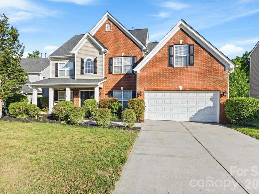 8458 Mossy Cup Trail, Harrisburg, NC 28075.  MLS# CAR4372770, YatesRealty ID 18086. Partial Brick Front with Inviting Front Porch.