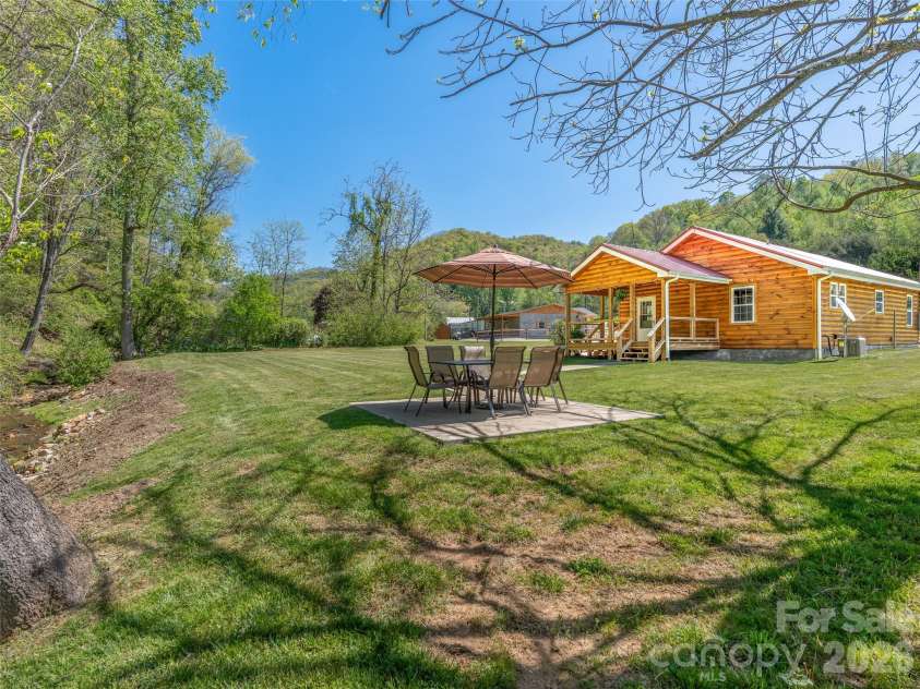 5881 US 23 Highway, Mars Hill, NC 28754.  MLS# CAR4374196, YatesRealty ID 18088. Creekside patio